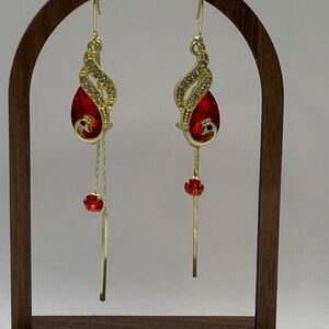 Elegant Gold and Red Dangle Earrings with Peacock Motif